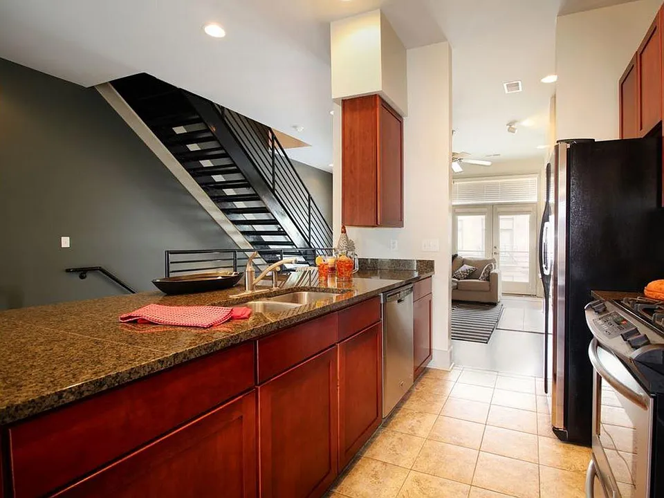 Kitchen with stainless steel appliances including gas stove