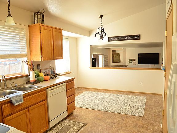 Kitchen and breakfast dining area that overlooks family room. Large pantry on right
