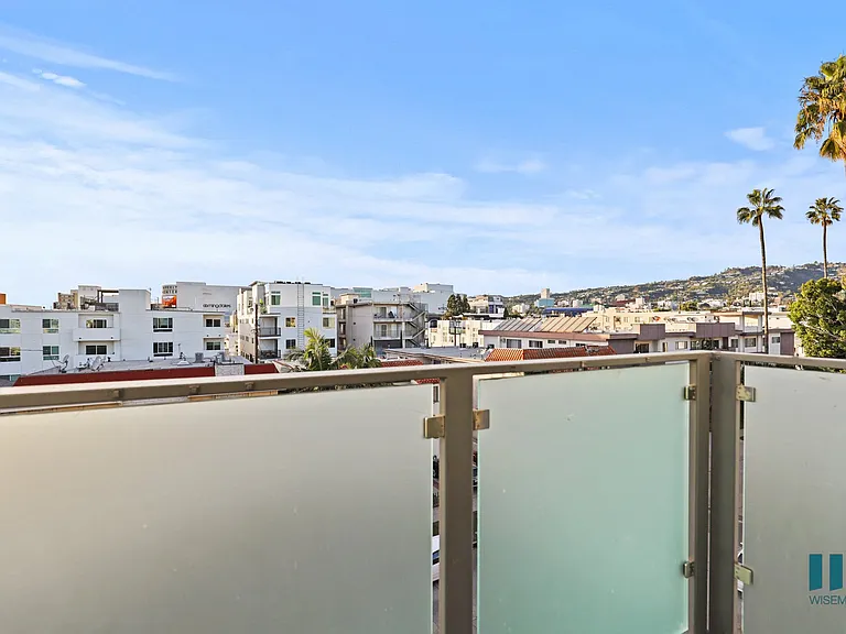 Upper Level Balcony with Skyline Views
