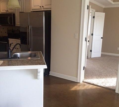 View from family rm, into kitchen and straight ahead is the master.