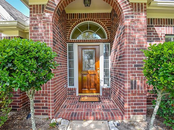 Elegant bricked entry, and leaded glass front door with sidelights. Welcome to your new home!