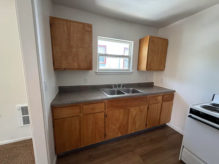 kitchen cabinets refinished, nice flooring, sit alone elec. stove
