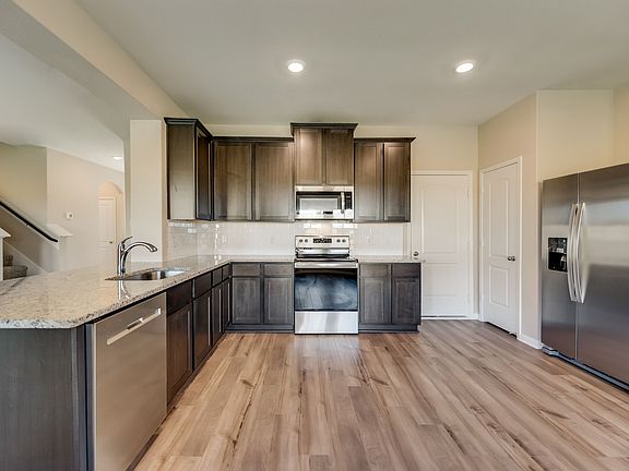The Higgins features a full suite of stainless steel appliances.