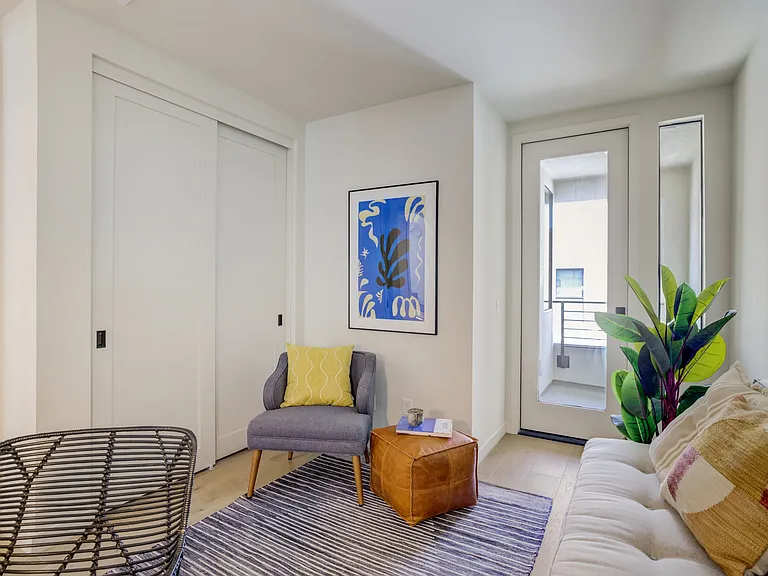 Second bedroom located on the third floor with its own private balcony and closet.