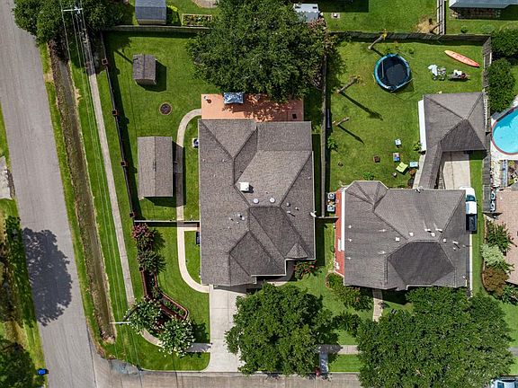 Extra large corner lot, two sheds, large patio and screened in porch