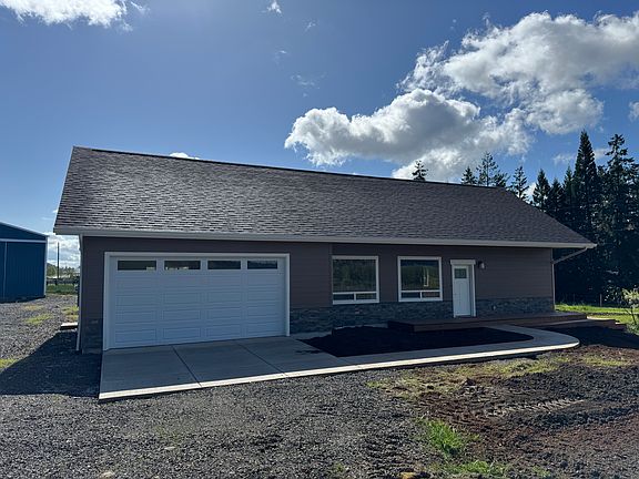 Front of the house facing west with attached oversized two car garage