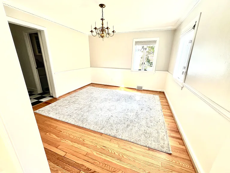 Dining Room. Shows new carpet that can be kept in place, or removed if you prefer.