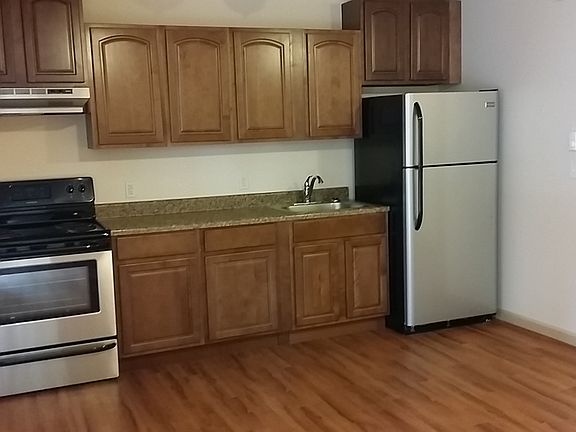 Stainless Steel Appliances, Upgraded Maple Cabinets, Wood-style Plank Flooring