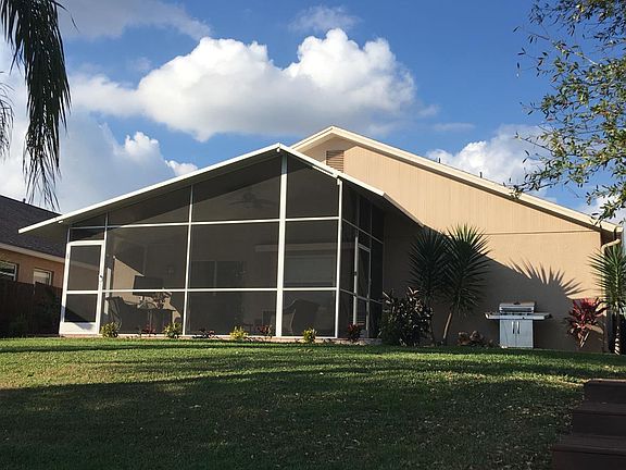 View from down by water looking up to house and lanai
