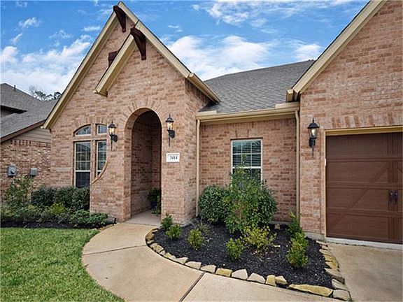 To the left of the two full-sized garage bays is a large workshop/storage area.