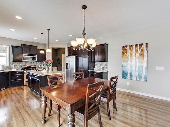 The kitchen is the heart of the home. Custom tile back-splash, granite counters and island. Convenient entry from the garage.