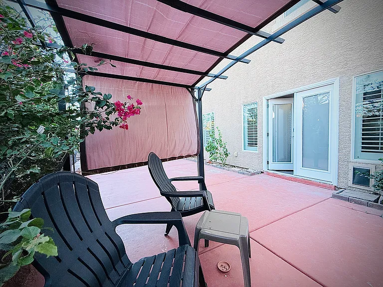 Enjoy the beautiful weather by our enchanted garden under a gazebo.