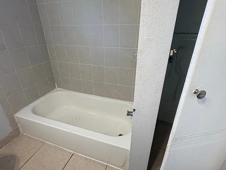 common bath tub and linen closet