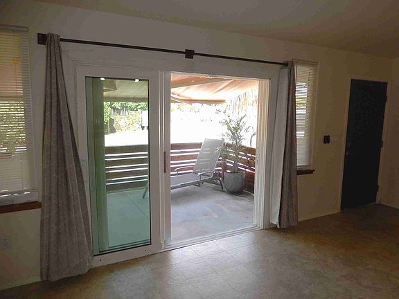 Tri-sliding glass door from living room to lanai