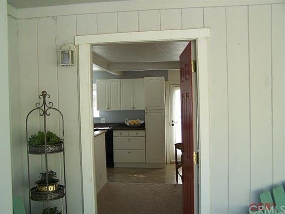 And enter the cottage, with kitchen to left, dining middle, living to right.