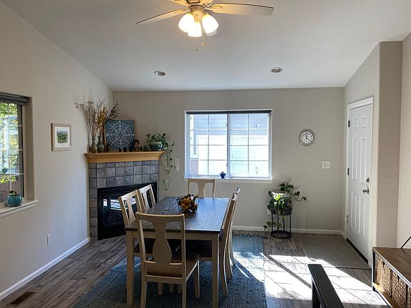 This room can be used as a sitting area or dining room. The door on the right is the one-car garage.