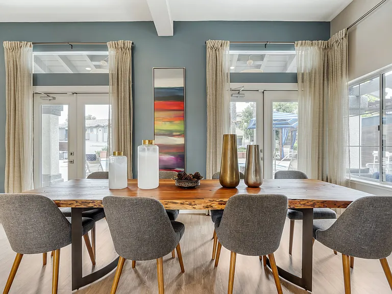 The clubhouse includes a spacious table with seating for up to eight peopleperfect for group gatherings, meetings, or enjoying coffee and conversation with friends and neighbors.