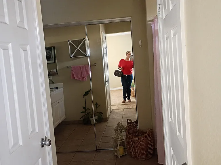 Primary Suite Bathroom Entrance/Walk-In Closet Mirror Doors/Toilet Door (left) and Storage Door (right)