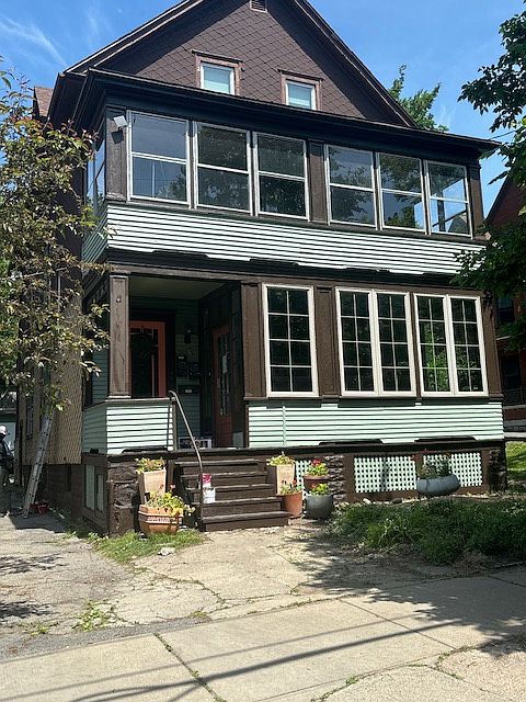 Exterior, perennial garden in the front, Glassed in private porch on the second floor is attached to the apartment.
