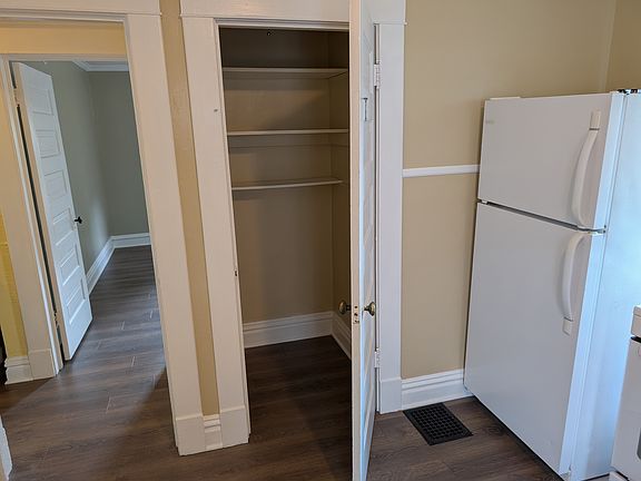 The pantry closet provides ample space for storage.