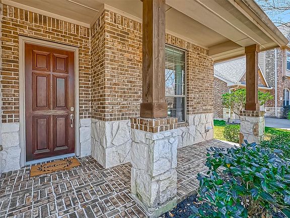 This front porch is the perfect place for sitting outside and getting some fresh air.