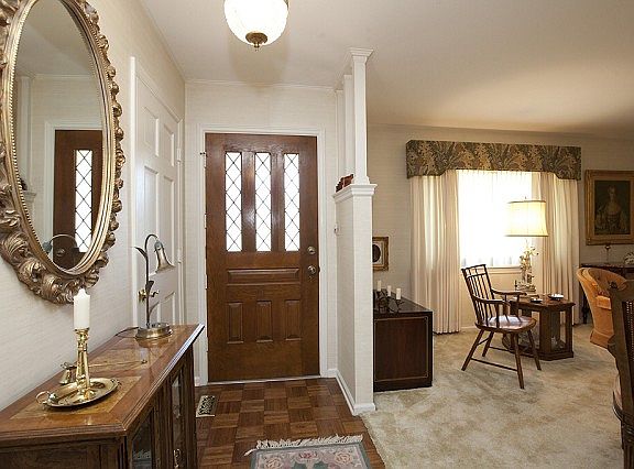 Entry opens to formal living and dining