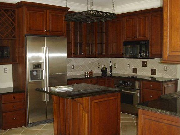 open kitchen with granite c-tops and stainless steel appliances, brkfast nook