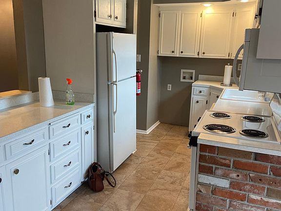 Galley kitchen open to living room.