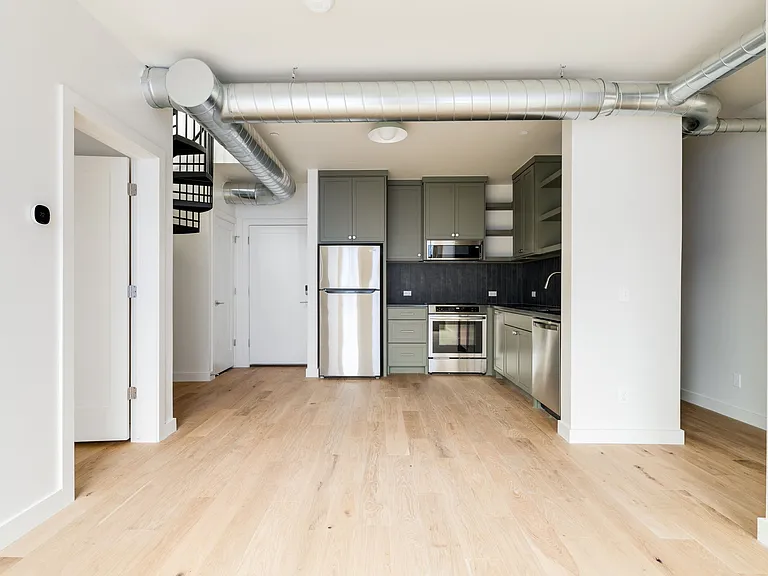 View of entry and kitchen from living room