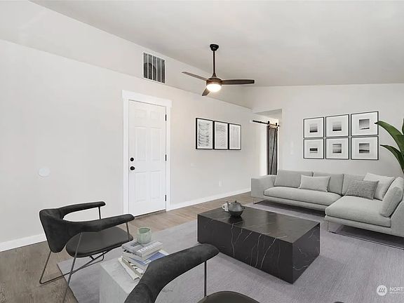 Living room from front looking to garage enty