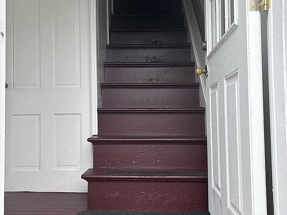 Private entrance with walk-up stairwell