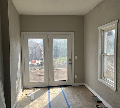 Largest Bedroom w/ door to Deck and back yard.
