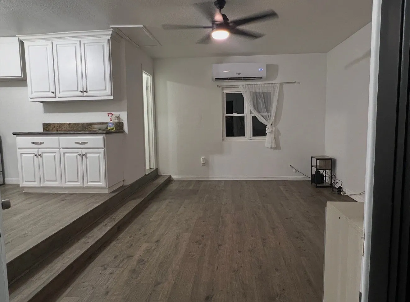 This 1-bedroom, 1-bath home features a spacious backyard, perfect for relaxing and enjoying — Photo 1