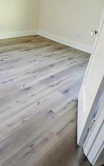 Bedroom with new floors, new window and paint