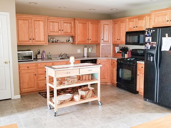 Larch Kitchen with appliances included.