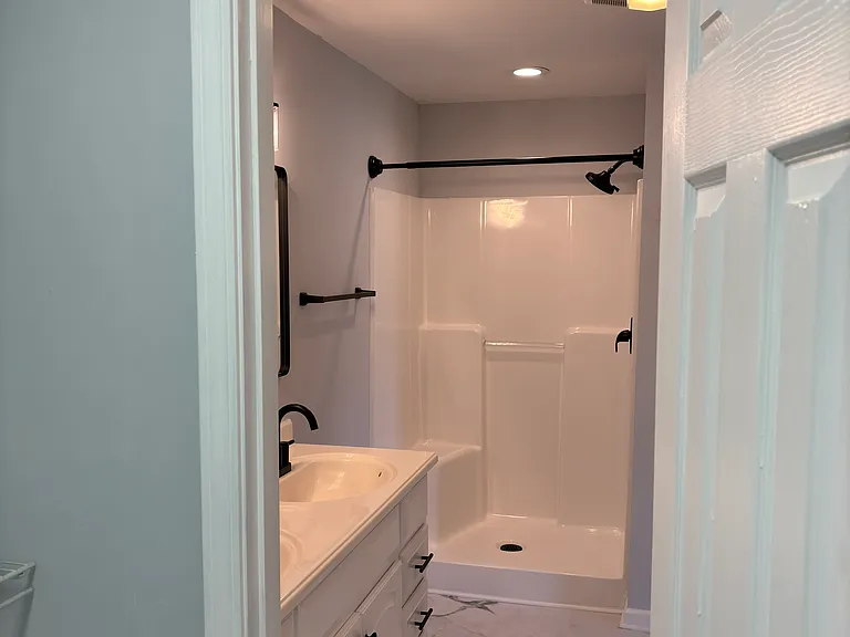 View from walk-in closet of master bathroom