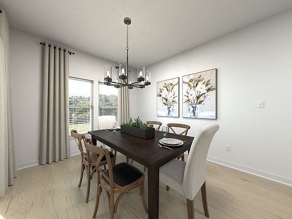 Dining room in the Chandler floorplan at Meritage Homes community.