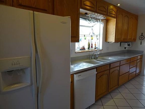 Corian counters, solid Oak carpentry, tile flooring in kitchen