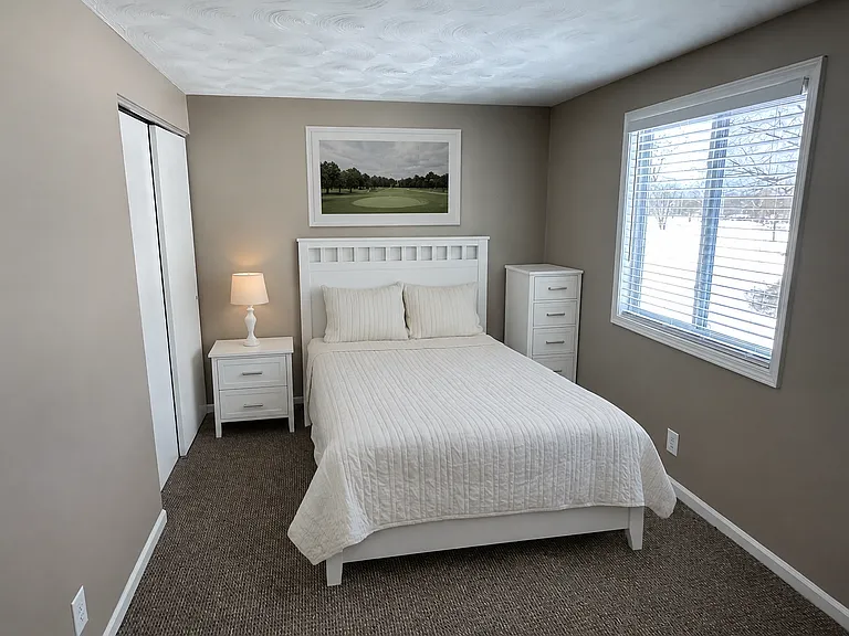 Bedroom 1 of 3. All bedrooms have closets. All bedrooms have been freshly painted with new carpeting and new wood faux blinds