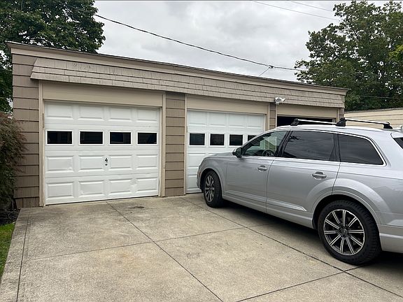 This unit comes with two garage spaces and two spaces in front of the garage (4 in total). Each garage door has a garage door opener.