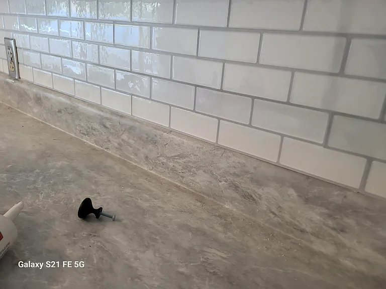 The tile counters in kitchen have been replaced