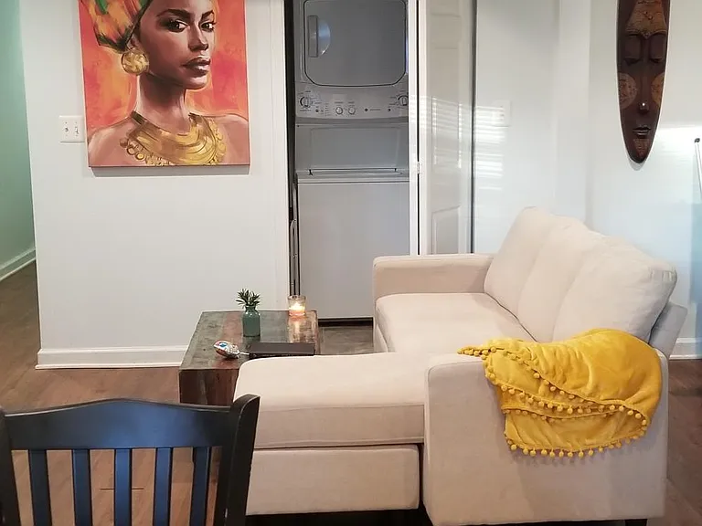 Living room leading to half bathroom - furnishings not included