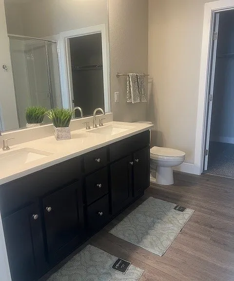 Spacious bathroom with a tub, shower and walk in closet!