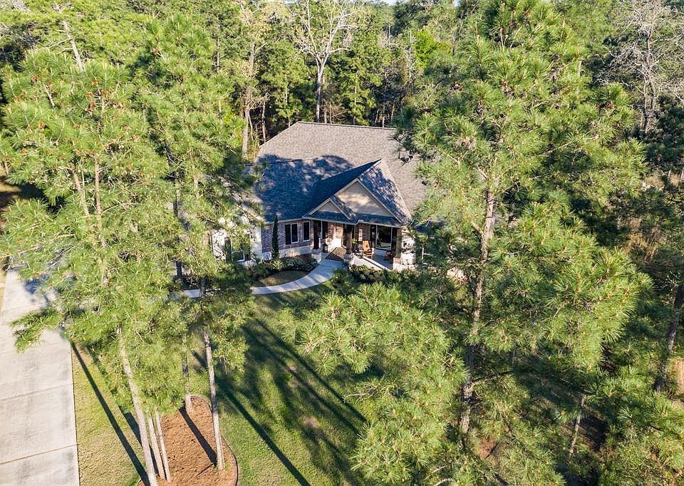Tucked away on a wooded cul-de-sac lot in High Meadow Ranch, you'll find this beautiful custom home.