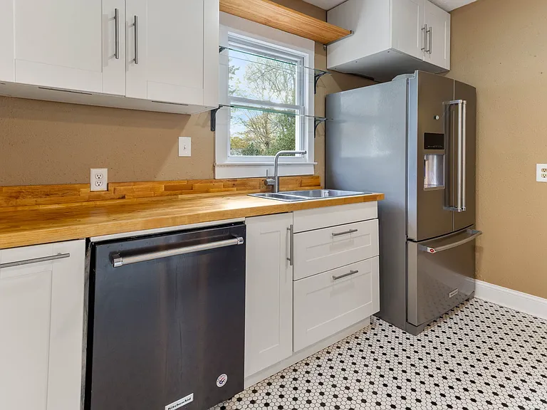 stainless Kitchen Aid Appliances and Penny Tile floor at 907 W Wendover ave