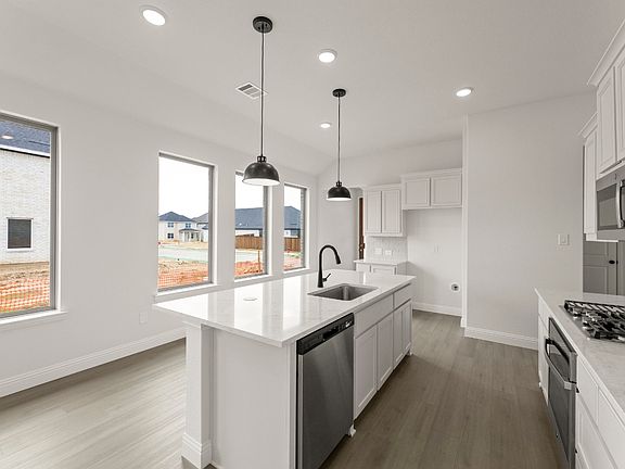 Stonegate one-story floor plan featuring 4 bedrooms, 2 bathrooms, an open family room, chef-inspired