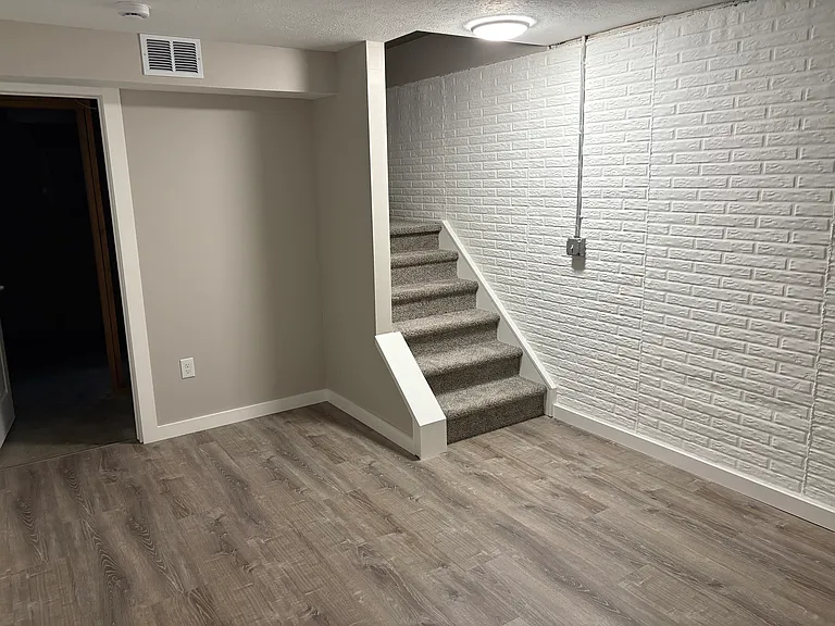 Finished Basement Area Room 4, Door to Washer/Dryer Room, Stairs to main/1st floor