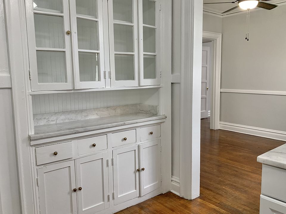 Kitchen with china cabinet flows to the formal dining room