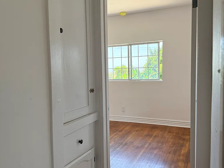 Hallway with Linen Closet leading to 2nd bedroom