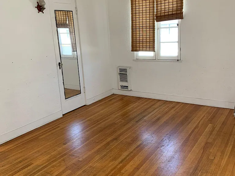 2nd floor bedroom with window facing north; there are also windows facing east and south